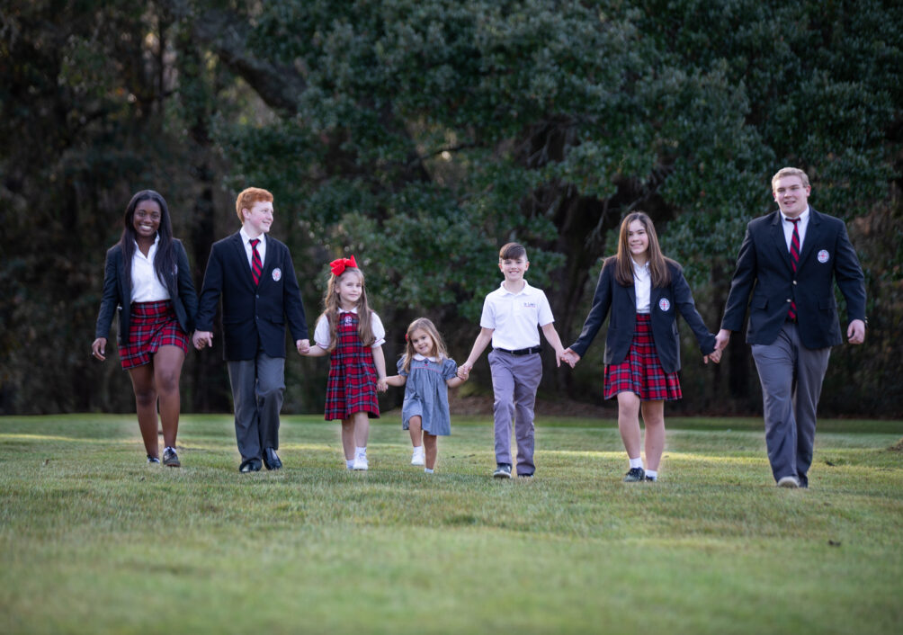 Students from each division wear their proper uniform and walk hand in hand on the front lawn of St. Luke's Episcopal School