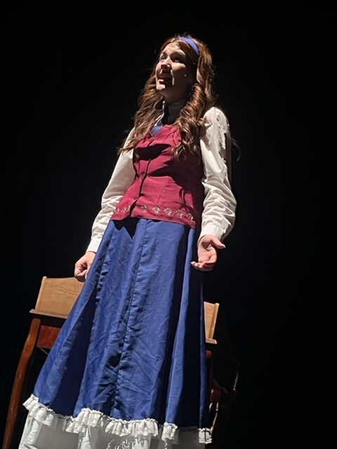 Girl on stage in theater production