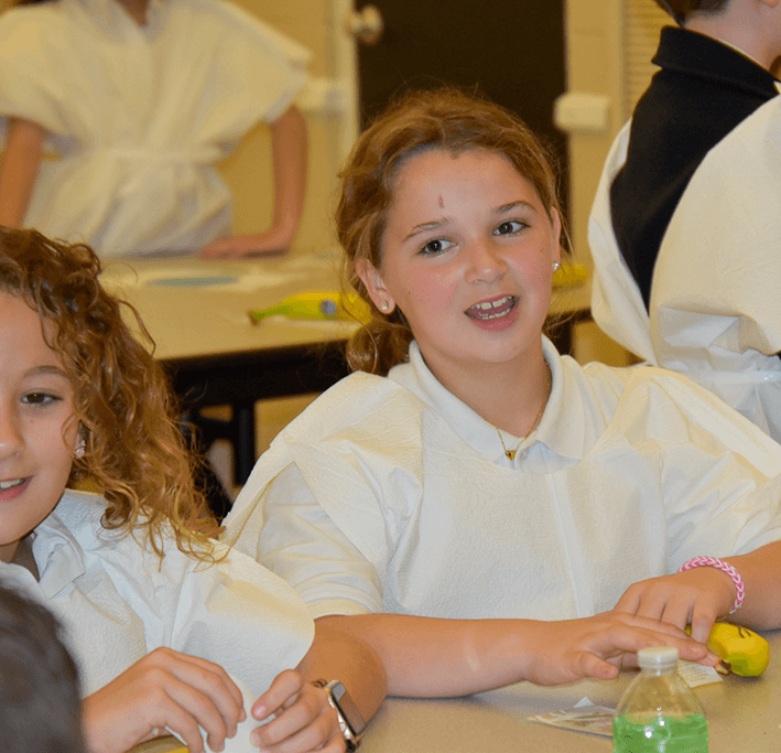 St, Luke's 4th Graders in Biomed Suturing a Banana