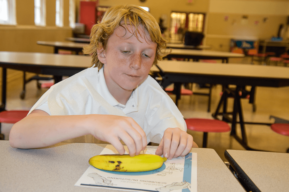 St, Luke's 4th Graders in Biomed Suturing a Banana