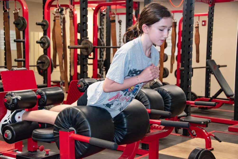 Middle school girl during strength and speed class